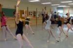 Young women dancing in ballet class.